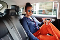 Rich,Business,African,Woman,On,Sunglasses,Sit,At,Suv,Car